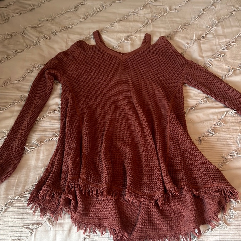 Oversized, off the shoulders sweater.